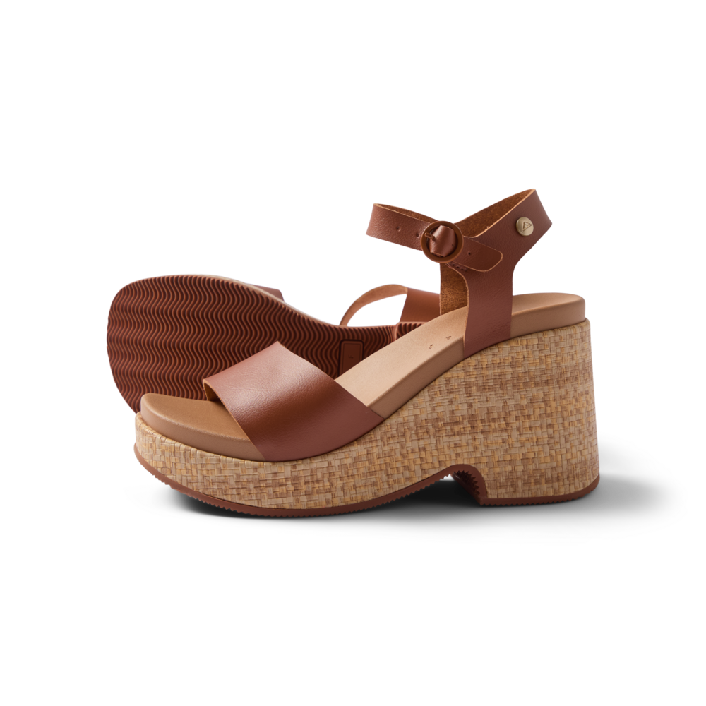 Sunset Sayulita women's brown leather sandals facing left, showing side and sole with anatomical arch support and cushioned footbed.