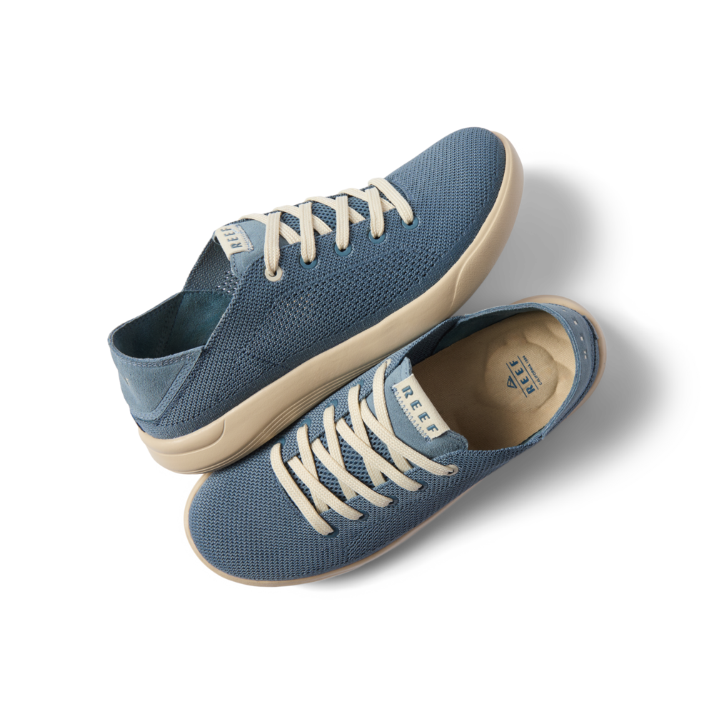 Neptune men's sneakers in true blue facing left and right, showing top and side views with cushioned, breathable mesh upper.