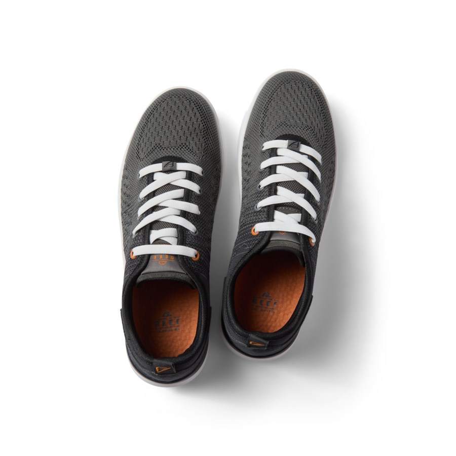 Top view of black Neso men's sneakers with white laces, featuring breathable mesh, arch support, and soft-rebound cushioning.