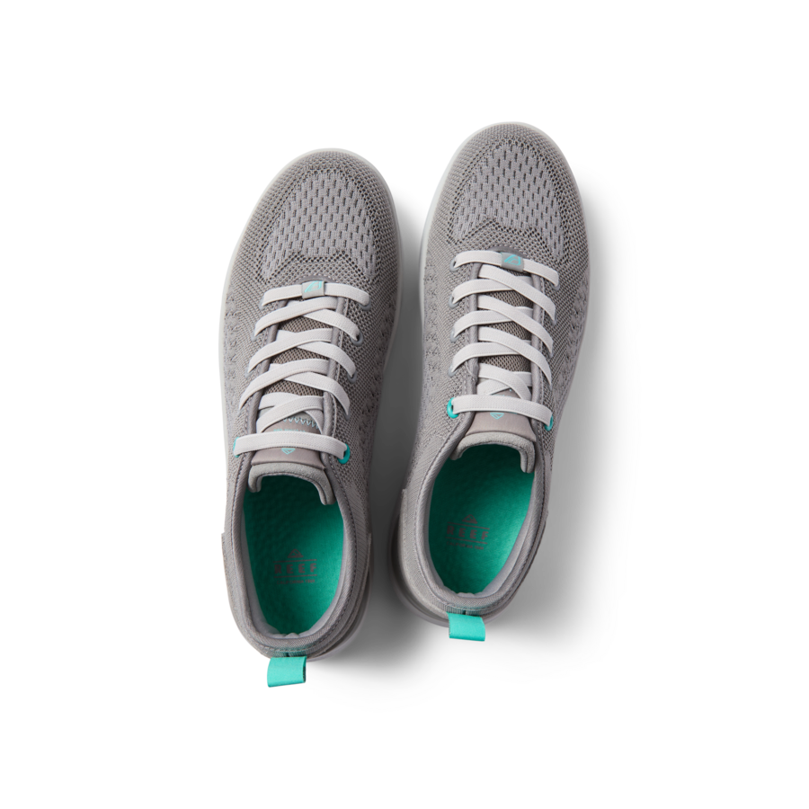 Top view of grey Neso men's sneakers by REEF featuring lightweight, water-friendly materials and anatomical arch support for beach comfort.