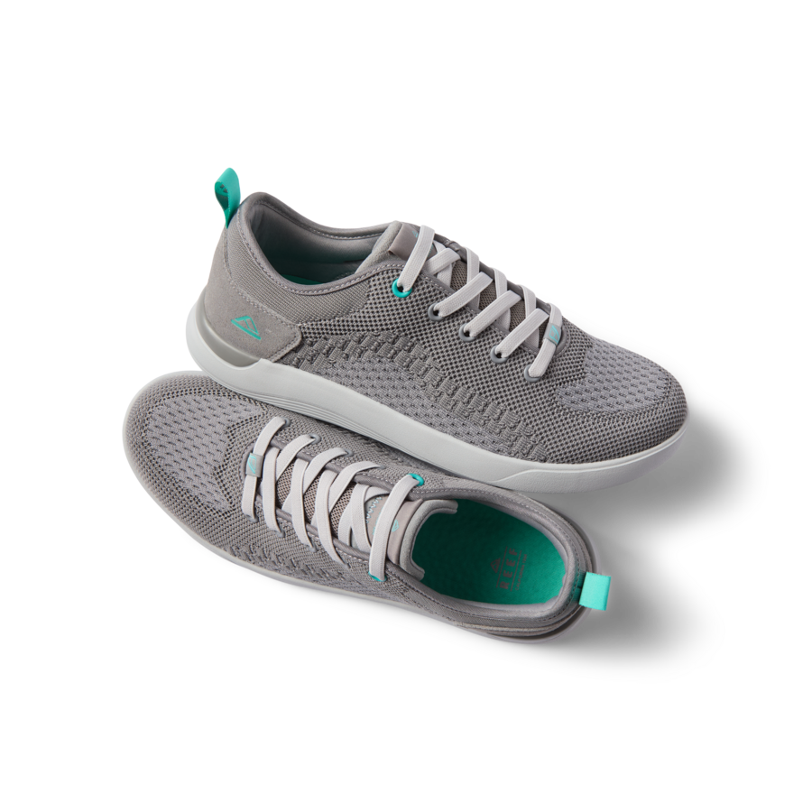 Pair of grey Neso men's shoes shown from side and top angles, featuring lightweight knit and cushioned sole for beach comfort.