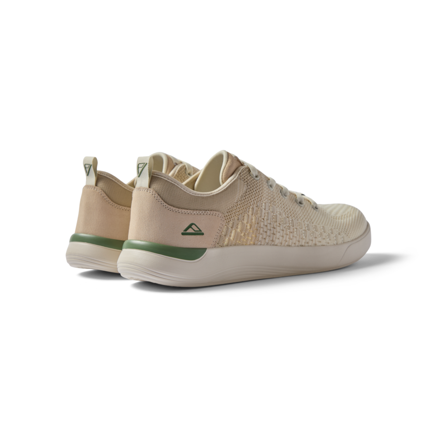 Neso men's shoes facing left rear showing heel and side with soft-rebound cushioning and anatomical arch support.