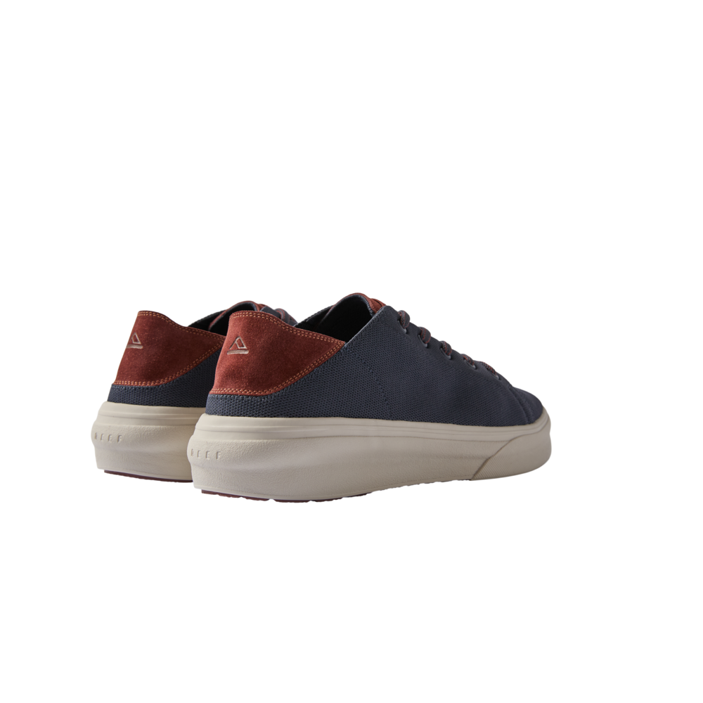 Atlantic men's navy and cappuccino sneakers facing away, highlighting heel with arch support and cushioned sole.