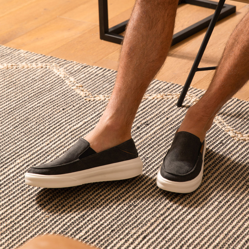 Pacific slip-on shoes in black facing left and right, highlighting comfort and durable, beach-inspired design.