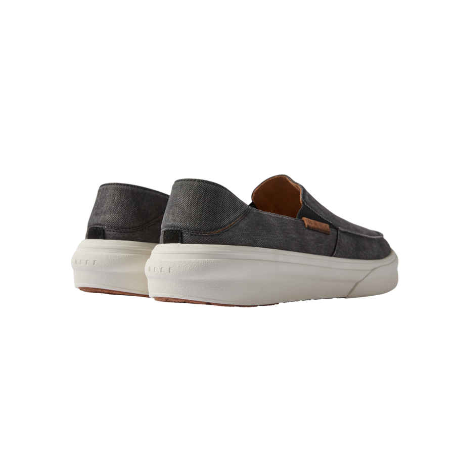 Pacific men's black slip-on shoes viewed from the back, showcasing lightweight, cushioned soles for beach comfort.