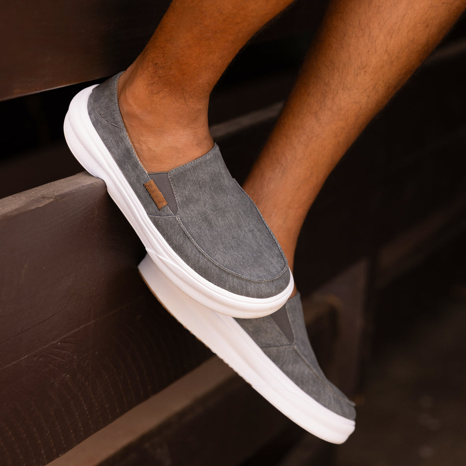 Pacific men's grey slip-on shoe facing left, close-up of upper and sole, beach-inspired comfort and durability.