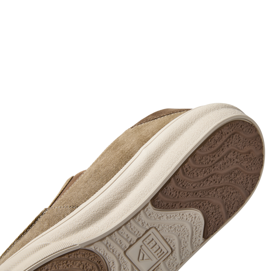 Pacific men's shoe in tan color showing angled side and breathable upper with textured rubber outsole facing right, surf inspired comfort.