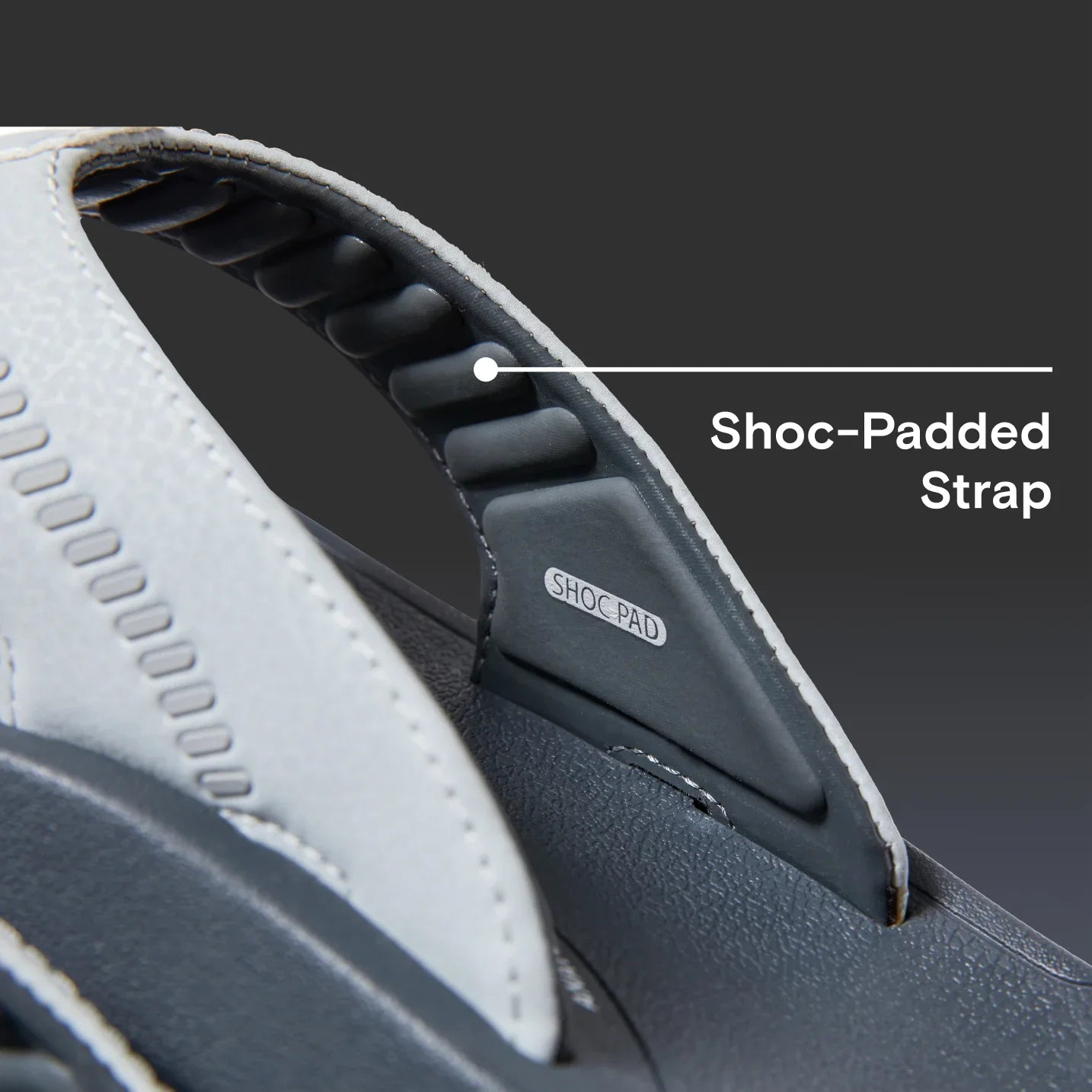 Close-up of the Cruiser sandal’s shock-padded strap showing soft-rebound cushioning for all-day beach comfort