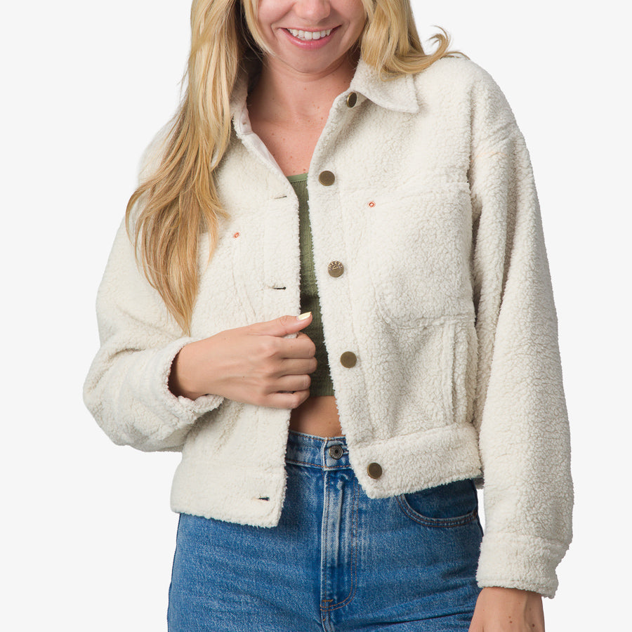 Woman wearing cream Sammie Sherpa Jacket front view, showcasing soft texture and relaxed fit with button closures