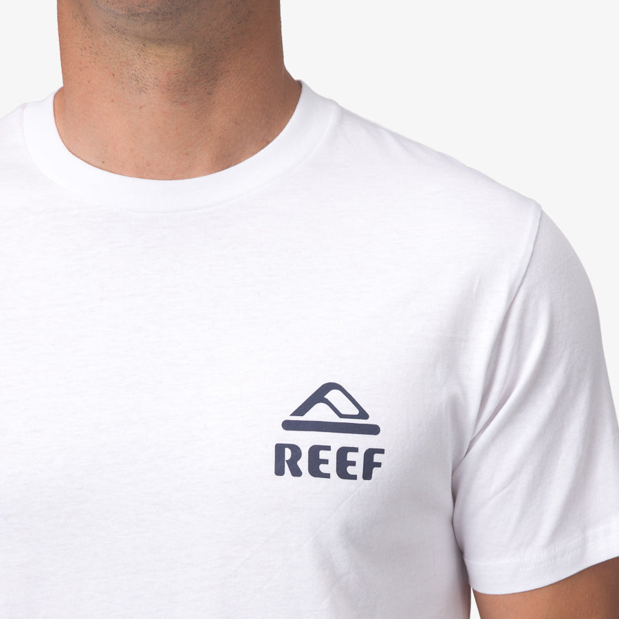 Seafan Tee close-up of white men's surf-inspired apparel with REEF logo, soft cotton for beach comfort and durability.