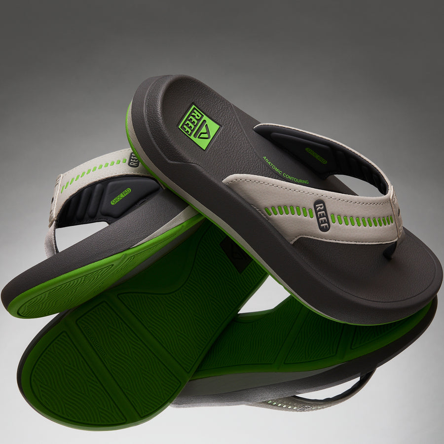 Cruiser men's flip flops facing right showing cushioned footbed and green textured outsole for beach comfort.