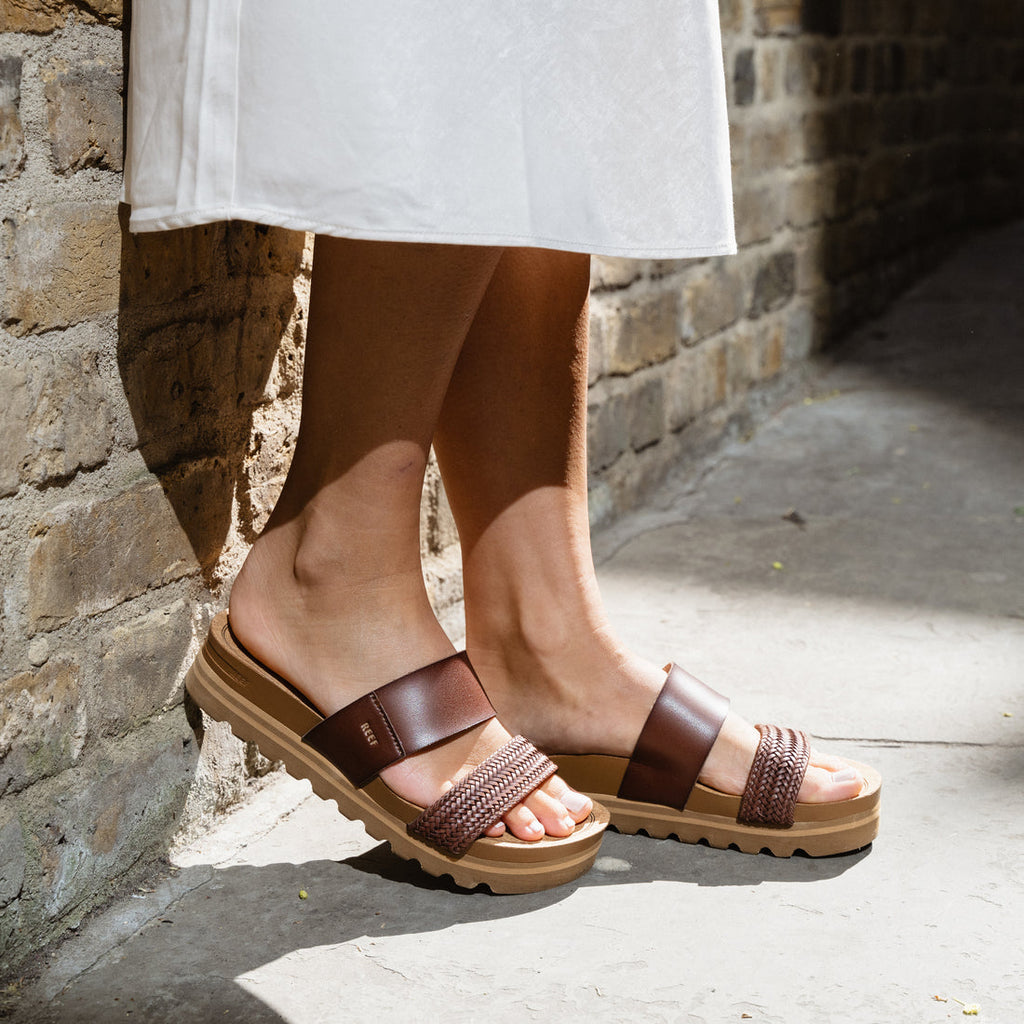 Cushion Vista Hi womens sandals facing right side, showing braided front strap and cushioned sole in sunlight.