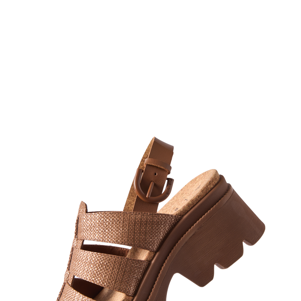 Vista Luxe Lucie women's sandal facing left, featuring chocolate raffia straps and comfort-focused cushioned sole.