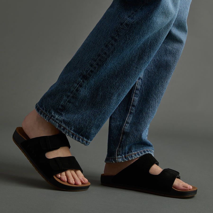 Ojai Two Bar sandals facing right, close-up on upper foot and straps, showing comfort-focused, beach-inspired design.