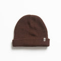 Alyx Beanie in brown knit fabric, close-up front view showing soft texture, designed for comfort and beach lifestyle.