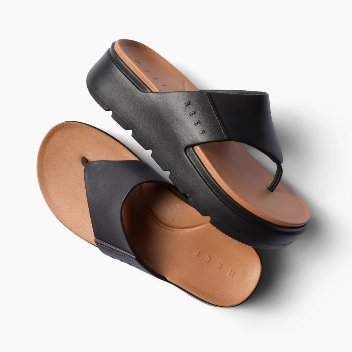 Cali Laguna black platform sandal top and side views showing cushioned tan footbed with anatomical arch support, water-friendly design