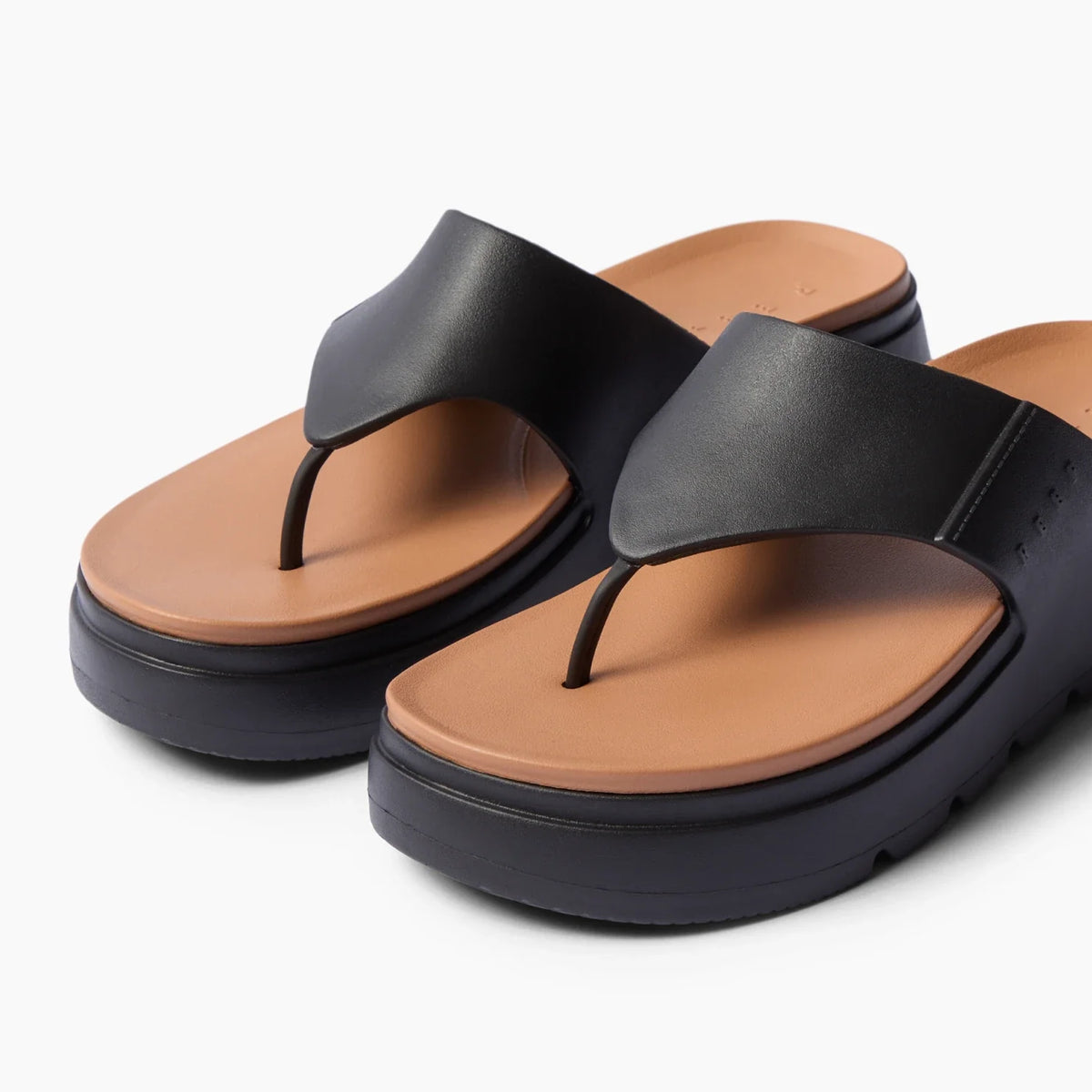 Cali Laguna black platform sandals facing left with molded brown footbed, water-friendly cushioned comfort for everyday wear