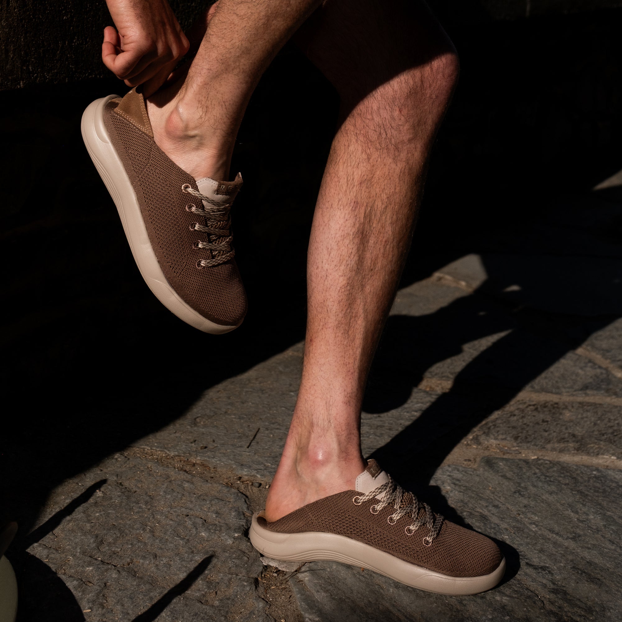 Neptune men's footwear, right shoe forward close-up showing lightweight, water-friendly upper and cushioned sole.